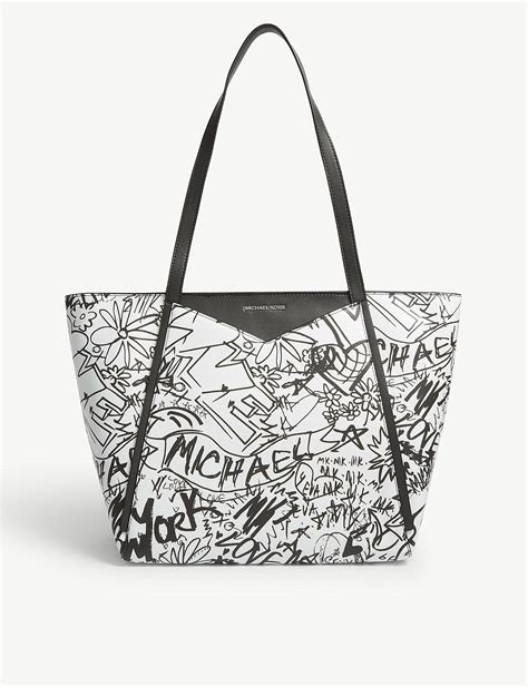 michael kors black and white graffiti design backpack|michael kors black belt bag.